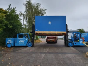 Install of a YCT 600 Press offloaded, de-crated and positioned into the factory.