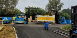 Install of a YCT 600 Press offloaded, de-crated and positioned into the factory.