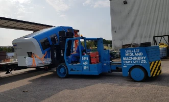 Install of a YCT 600 Press offloaded, de-crated and positioned into the factory.